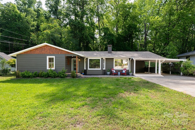 ranch-style home with an attached carport, a front yard, a chimney, concrete driveway, and covered porch