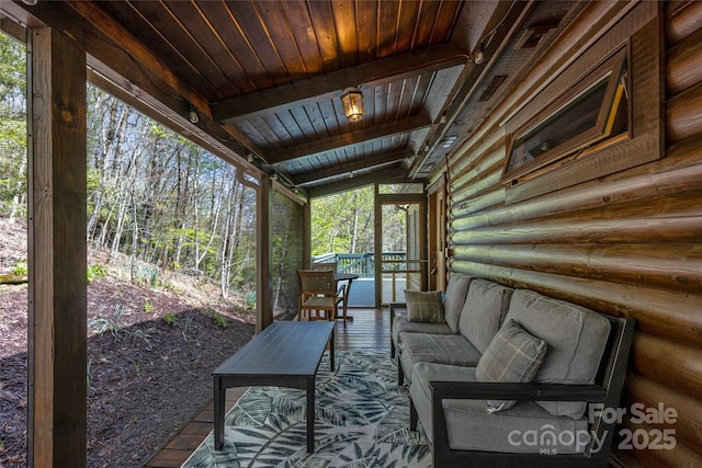 sunroom featuring an outdoor hangout area and healthy amount of natural light