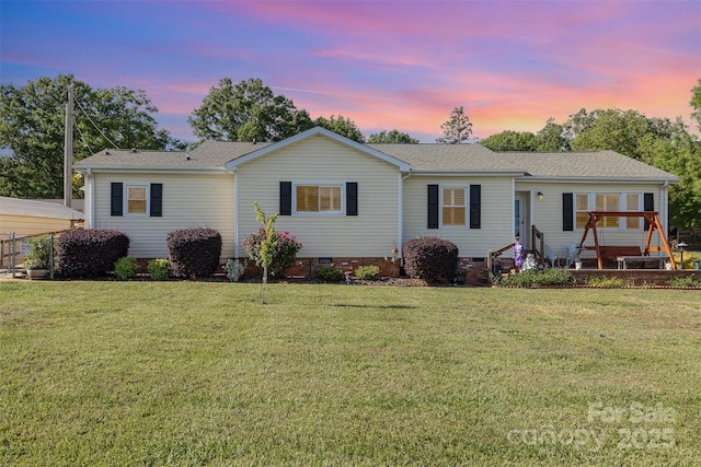 ranch-style home featuring a front lawn, crawl space, and a shingled roof