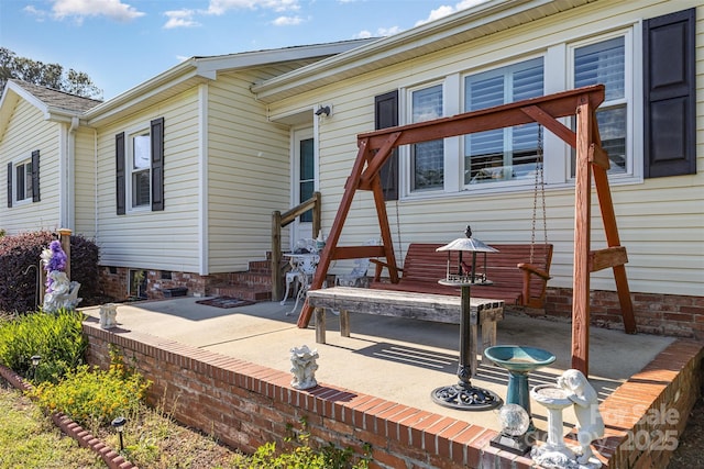 rear view of house with a patio area and entry steps