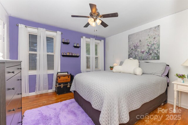 bedroom featuring wood finished floors and a ceiling fan