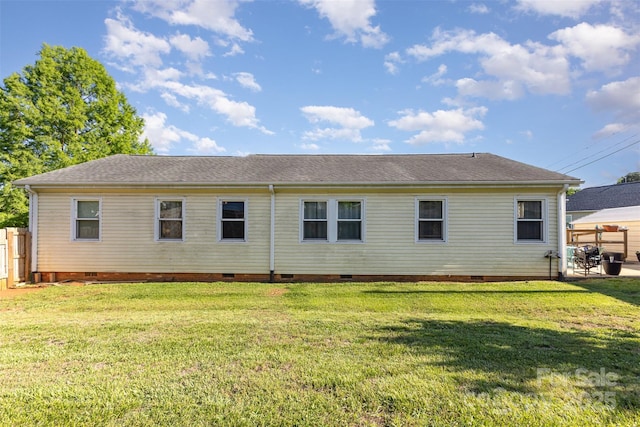 back of house featuring crawl space and a shingled roof