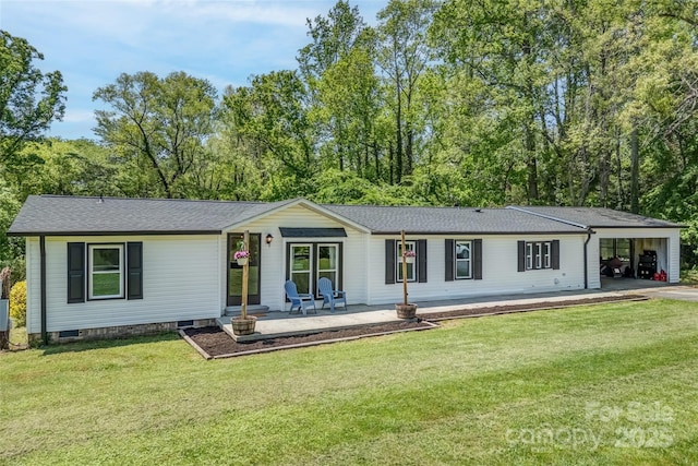 9 Ruby Dr, Hendersonville, NC 28792 - rear view of house with a lawn, a shingled roof, covered porch, and a carport