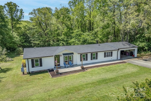 9 Ruby Dr, Hendersonville, NC 28792 - view of front of property featuring a front lawn, aphalt driveway, roof with shingles, and a carport