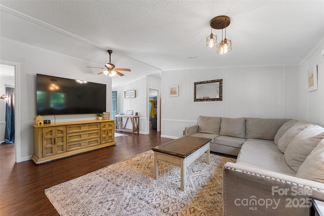 9 Ruby Dr, Hendersonville, NC 28792 - living room featuring ceiling fan, ornamental molding, dark wood-style flooring, and a textured ceiling