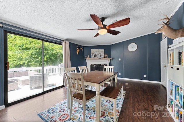 9 Ruby Dr, Hendersonville, NC 28792 - dining room with a textured ceiling, a ceiling fan, baseboards, wood finished floors, and ornamental molding