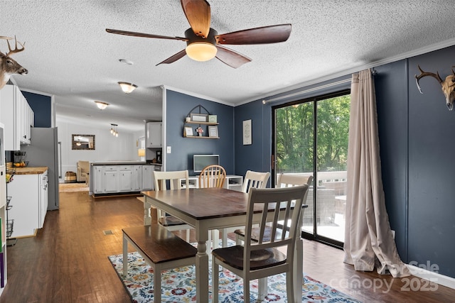9 Ruby Dr, Hendersonville, NC 28792 - dining area featuring crown molding, a ceiling fan, a textured ceiling, and dark wood finished floors