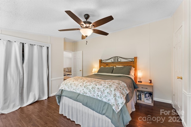 9 Ruby Dr, Hendersonville, NC 28792 - bedroom featuring a ceiling fan, a textured ceiling, dark wood-style floors, and baseboards