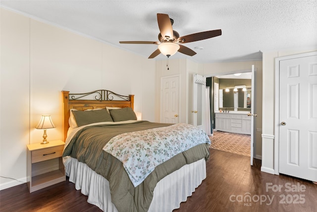 9 Ruby Dr, Hendersonville, NC 28792 - bedroom with crown molding, dark wood-style flooring, baseboards, a ceiling fan, and ensuite bath
