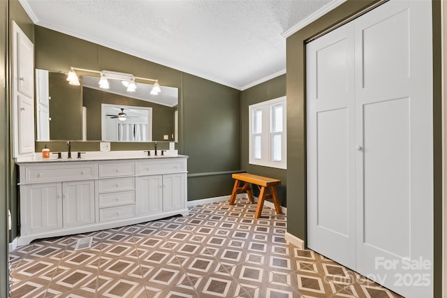 9 Ruby Dr, Hendersonville, NC 28792 - full bathroom with double vanity, a ceiling fan, a textured ceiling, crown molding, and a sink