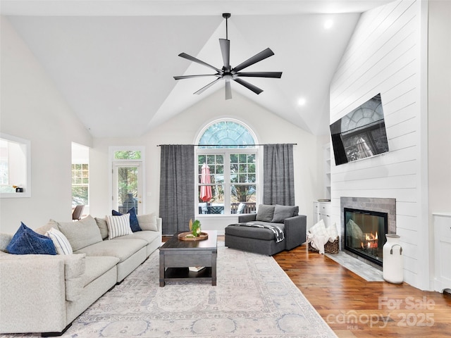 44 Chip Shot Ct, Mills River, NC 28759 - living area featuring a fireplace, a ceiling fan, recessed lighting, wood finished floors, and vaulted ceiling