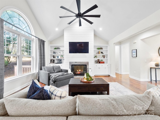 44 Chip Shot Ct, Mills River, NC 28759 - living room with plenty of natural light, a ceiling fan, baseboards, wood finished floors, and vaulted ceiling