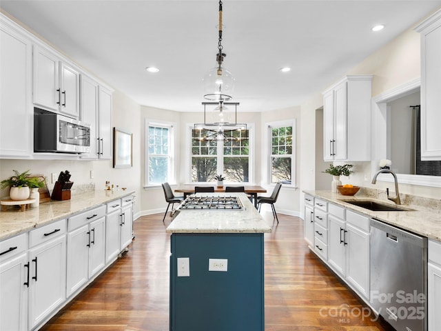 44 Chip Shot Ct, Mills River, NC 28759 - kitchen with dark wood-type flooring, a sink, appliances with stainless steel finishes, and white cabinets