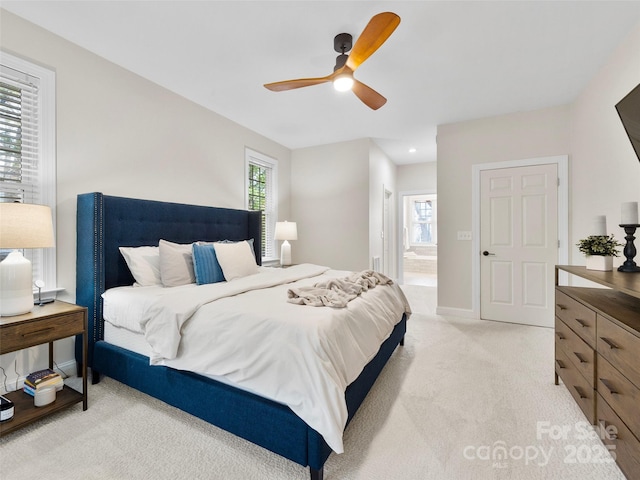 44 Chip Shot Ct, Mills River, NC 28759 - bedroom with light colored carpet, a ceiling fan, connected bathroom, and baseboards