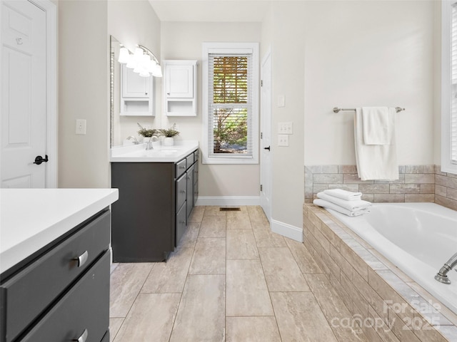 44 Chip Shot Ct, Mills River, NC 28759 - bathroom featuring vanity, baseboards, and a bath