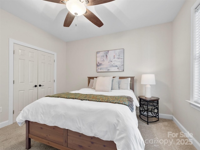 44 Chip Shot Ct, Mills River, NC 28759 - bedroom with a closet, baseboards, a ceiling fan, and light colored carpet