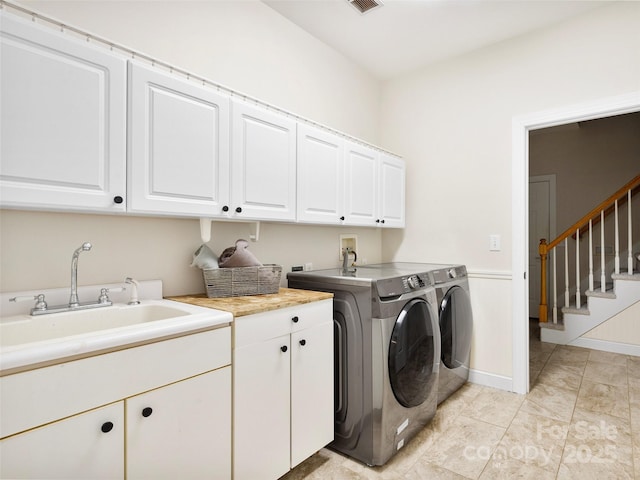44 Chip Shot Ct, Mills River, NC 28759 - laundry area with cabinet space, separate washer and dryer, visible vents, and a sink