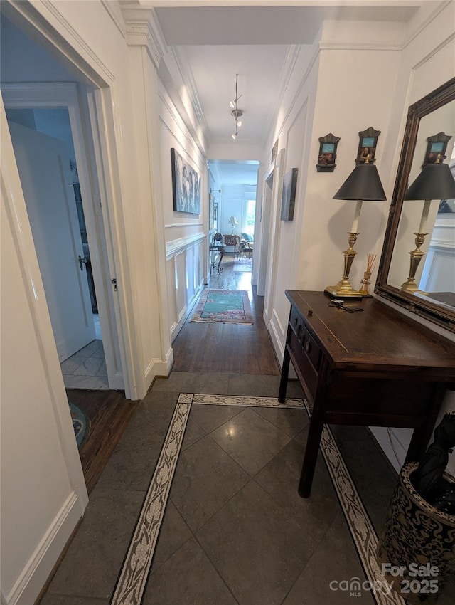 301 W 10th St W, Charlotte, NC 28202 - corridor with inlaid floor details, baseboards, and crown molding