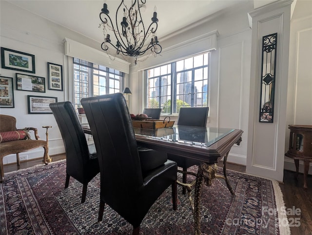301 W 10th St W, Charlotte, NC 28202 - dining space featuring a chandelier, wood finished floors, and baseboards