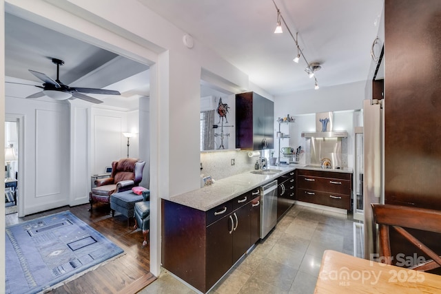 301 W 10th St W, Charlotte, NC 28202 - kitchen featuring dishwasher, dark brown cabinetry, ceiling fan, a sink, and light stone counters