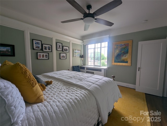 301 W 10th St W, Charlotte, NC 28202 - bedroom with baseboards and ceiling fan