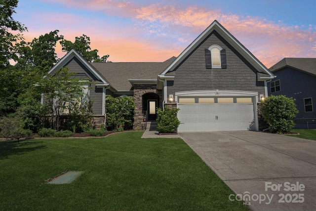 16427 Cozy Cove Rd, Charlotte, NC 28278 - view of front of home with driveway, a lawn, stone siding, and an attached garage