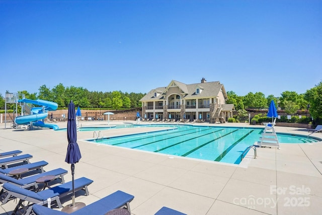 16427 Cozy Cove Rd, Charlotte, NC 28278 - community pool featuring a water slide and a patio