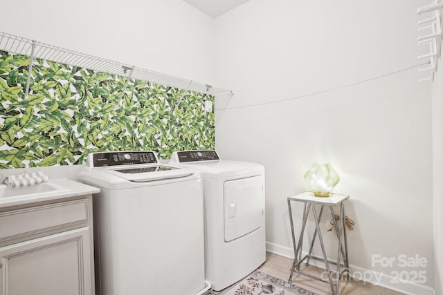 16427 Cozy Cove Rd, Charlotte, NC 28278 - washroom with washer and dryer, cabinet space, light tile patterned floors, and baseboards