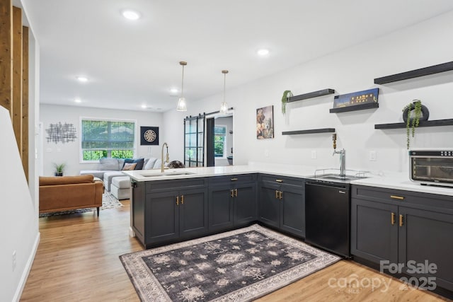 16427 Cozy Cove Rd, Charlotte, NC 28278 - kitchen with a peninsula, a sink, open shelves, light wood-style flooring, and light countertops