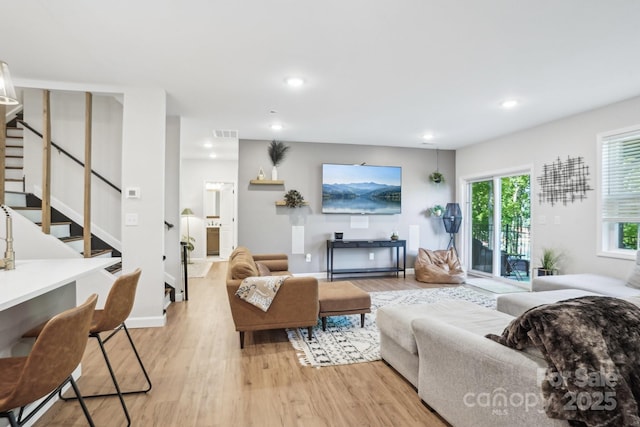 16427 Cozy Cove Rd, Charlotte, NC 28278 - living area featuring light wood-type flooring, stairway, recessed lighting, and baseboards