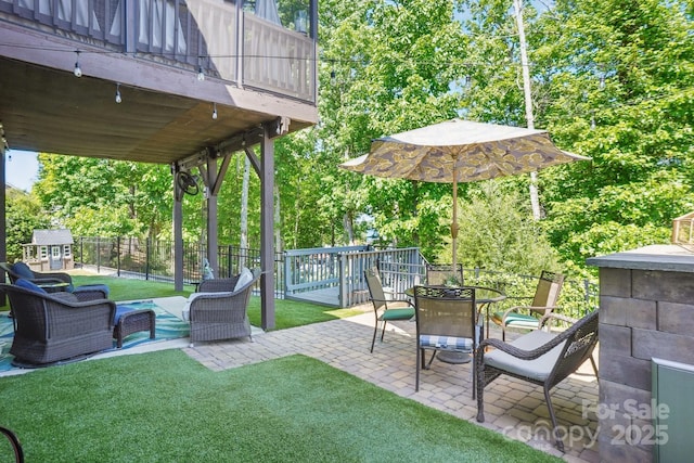 16427 Cozy Cove Rd, Charlotte, NC 28278 - view of yard featuring a patio, outdoor dining area, view of wooded area, and an outdoor hangout area