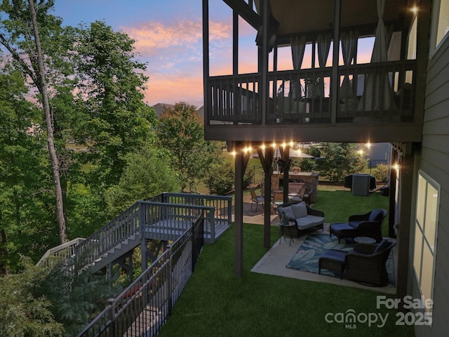16427 Cozy Cove Rd, Charlotte, NC 28278 - yard at dusk featuring stairs, a patio, a lawn, and a deck