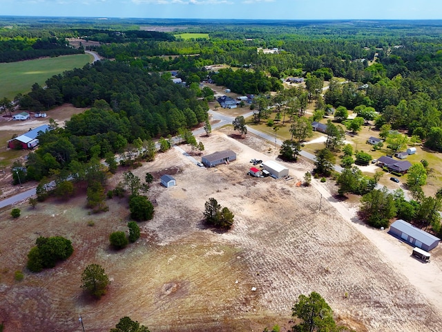 aerial view featuring a view of trees