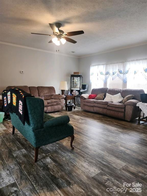 living room with crown molding, a ceiling fan, a textured ceiling, and wood finished floors