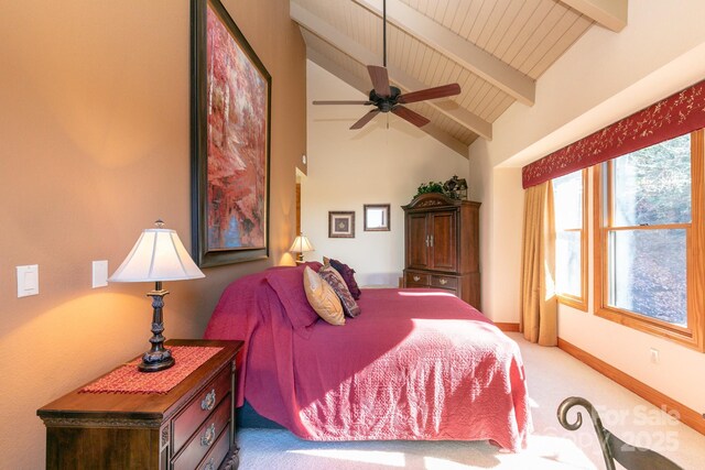 bedroom featuring carpet flooring, beamed ceiling, baseboards, wood ceiling, and high vaulted ceiling