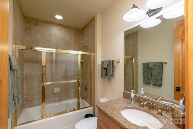 full bath featuring vanity, toilet, and enclosed tub / shower combo