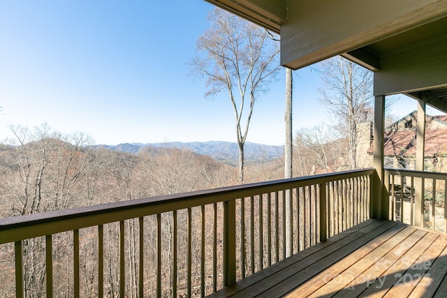 wooden deck featuring a mountain view