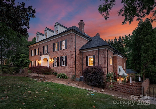 3314 Leamington Ln, Charlotte, NC 28226 - view of front facade with brick siding and a chimney