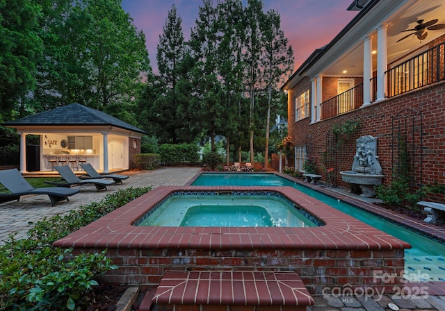3314 Leamington Ln, Charlotte, NC 28226 - view of pool with an in-ground hot tub, a patio, ceiling fan, and an outbuilding