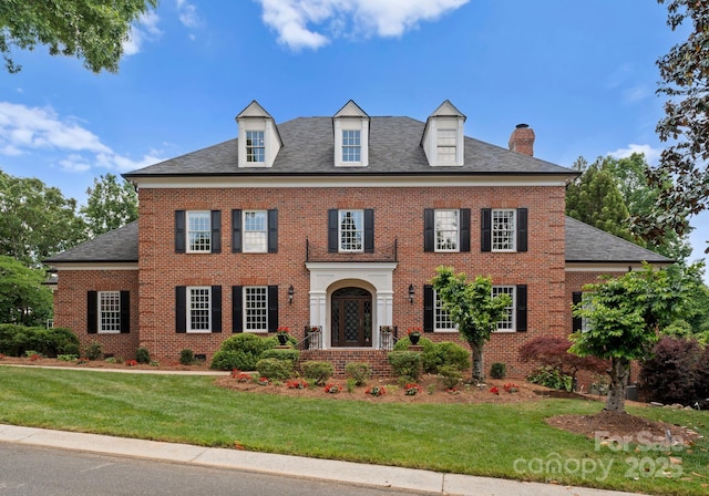 3314 Leamington Ln, Charlotte, NC 28226 - colonial-style house featuring a chimney, a front yard, and brick siding