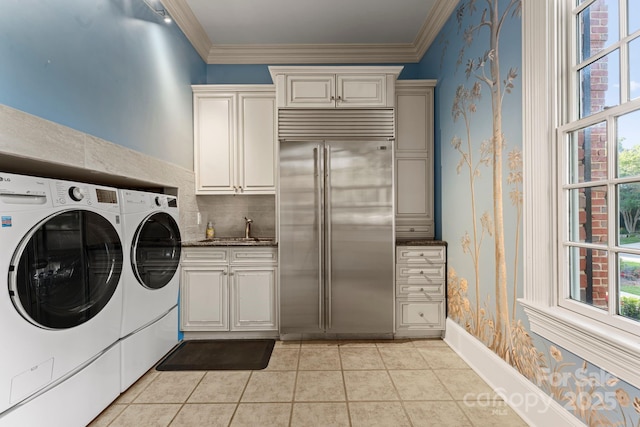 3314 Leamington Ln, Charlotte, NC 28226 - washroom with washing machine and dryer, crown molding, light tile patterned floors, cabinet space, and wallpapered walls
