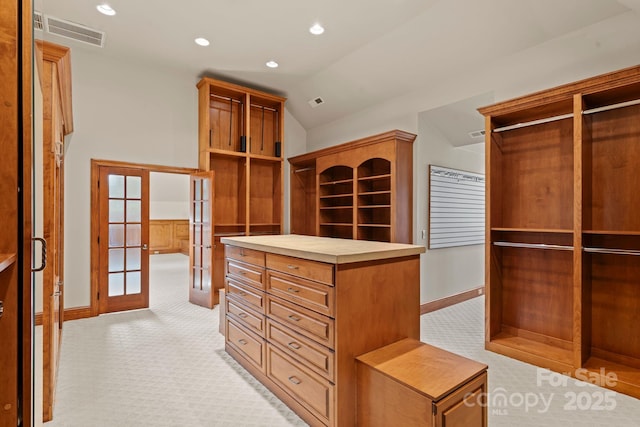 3314 Leamington Ln, Charlotte, NC 28226 - spacious closet with french doors, light carpet, and vaulted ceiling