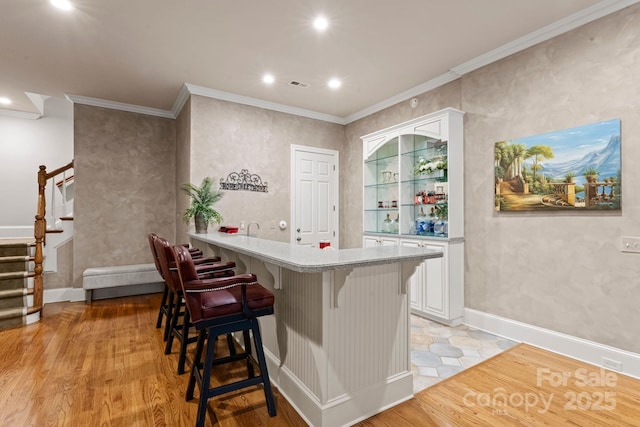 3314 Leamington Ln, Charlotte, NC 28226 - bar featuring stairway, recessed lighting, ornamental molding, light wood-style floors, and baseboards