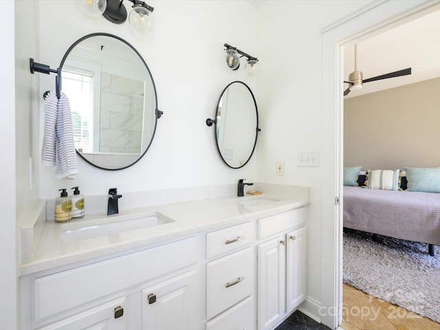 bathroom featuring a sink, double vanity, ensuite bathroom, and tile patterned flooring