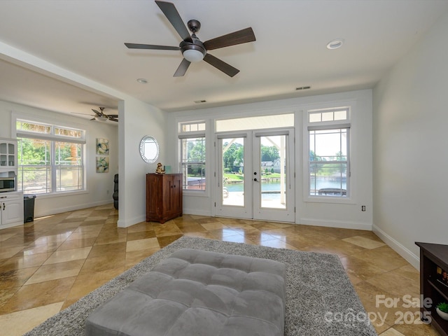 entryway with light tile patterned floors, visible vents, baseboards, ceiling fan, and recessed lighting