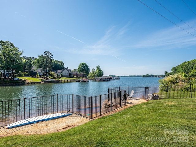 property view of water featuring fence