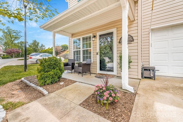 41 Lanceford Cir, Fletcher, NC 28732 - view of exterior entry featuring a porch and an attached garage
