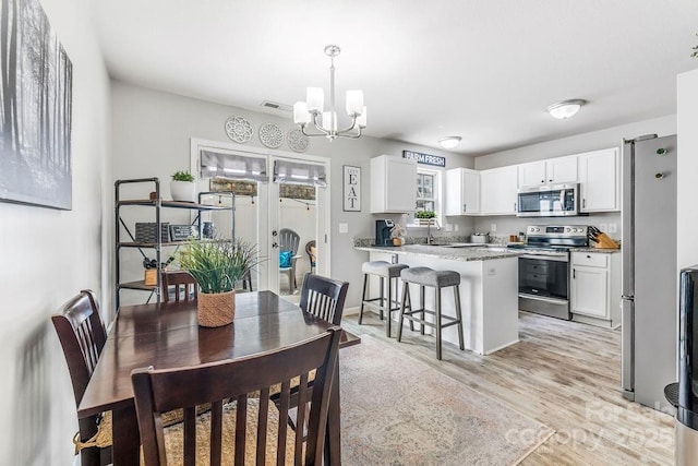 41 Lanceford Cir, Fletcher, NC 28732 - dining space featuring a chandelier and light wood-style floors