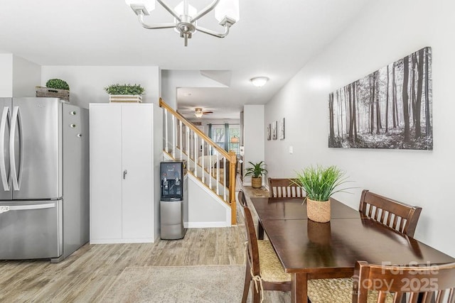 41 Lanceford Cir, Fletcher, NC 28732 - dining area with light wood-style floors, stairs, and a chandelier