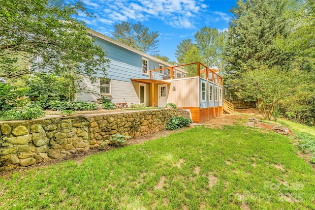 exterior space with a yard and a deck